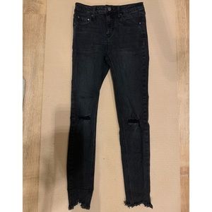 Women’s black ripped skinny jeans